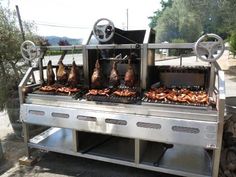 the grill is full of different kinds of meats