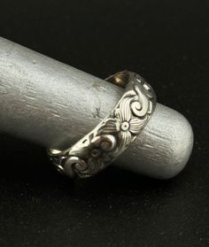 Embrace the regal elegance of the past with our Thick Engraved Old English Style Sterling Silver 925 Ring. This statement band draws inspiration from the rich heritage of Old English artistry, featuring deep, intricate engravings that embody the era's grandeur. Crafted from high-quality sterling silver 925, this ring is not just a piece of jewelry but a bold statement of vintage-inspired luxury. Designed for those who appreciate the beauty of historical designs and the timeless appeal of sterling silver, this ring makes a striking addition to any collection. Whether worn as a standout piece or paired with other favorites, it promises to bring a touch of sophistication and old-world charm to your ensemble. Classic Silver Engraved Ring For Ceremonial Occasions, Classic Ceremonial Engraved Ring With Etched Details, Classic Sterling Silver Engraved Ring For Ceremonial Occasions, Vintage Adjustable Engraved Etched Ring, Vintage Adjustable Engraved Ring, Vintage Ceremonial Ring With Engraving Option, Ornate Engraved Ring For Ceremonial Occasions, Vintage Engraved Silver Ring, Vintage Ceremonial Engraved Ring