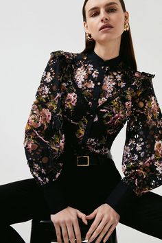 Proving That Floral Prints Don'T Have To Be Ultra-Girlish, This Vampish Broderie Lace Blouse Shows Off Gothic-Style Blooms And A Statement-Making Silhouette. Perfect For Pepping Up Plain Denim, Frilled Shoulders And Voluminous Puff Sleeves Guarantee A Dash Of Glamour. Gothic Lace Tops For Fall, Gothic Lace Top For Fall, Spring Gothic Blouse With Ruffles, Gothic Ruffled Blouse For Spring, Party Lace Tops With Floral Print, Elegant Lace Blouse With Floral Print, Fitted Floral Print Lace Top For Spring, Black Lace Collar Top For Spring, Fitted Floral Print Lace Top