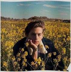 a person sitting in a field with yellow flowers and the caption, thinking about my recent decision like