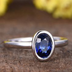 5x7mm Oval Cut natural Tanzanite engagement ring,plain wedding band,bridal ring,14k white gold promise ring,deco bezel ring,anniversary Solid 14k white/ rose/yellow gold width of band about 1.4mm Main Stone: Natural Tanzanite Carat Weight: 5x7mm Cut: Oval Cut Gem Weight: 1ctw Clarity: VS Setting Style: Bezel, Pave Other Features:Comfort Fit Jewelry maintenance tips ▶ To avoid of chemical reactions,do not touch with daily chemicals,such as soap,shower gel,shampoo,chemicals. ▶ To avoid deformation Elegant Sapphire Ring With Tanzanite And Polished Finish, 14k White Gold Jewelry With Bezel Setting, Timeless White Gold Tanzanite Ring, Timeless Tanzanite Jewelry With Prong Setting, Timeless Silver Tanzanite Rings, Timeless Tanzanite Promise Ring, Promise Ring Sapphire With Polished Finish Emerald Cut, Promise Ring: Sapphire With Polished Finish, Emerald Cut, Minimalist Oval Sapphire Ring