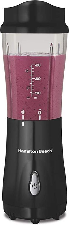 a black blender with pink liquid in it