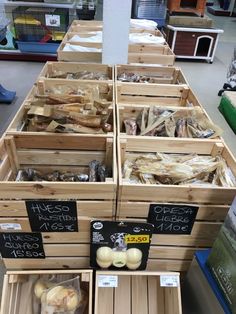 several wooden crates filled with different types of food