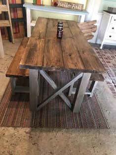 a wooden table sitting on top of a rug