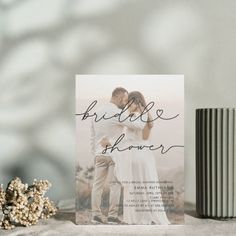 a photo of a bride and groom on their wedding day with the words'bridal shower'in cursive font