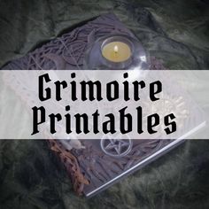 a candle is sitting on top of a book with the words grimoire printables