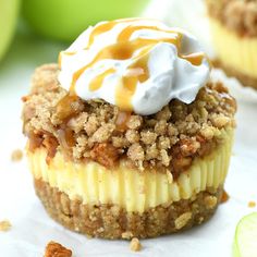 an apple dessert with whipped cream and caramel drizzled on the top