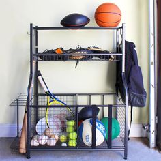 a rack with various sports equipment on it and a basketball sitting on top of it