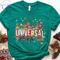 an unisex tshirt with the word universal on it, surrounded by christmas decorations