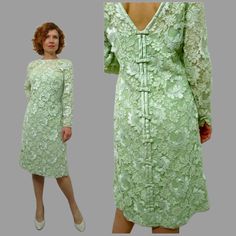 Vintage 1960 dress. This brilliant spring piece is made of royal Chantelle lace that is all of excellent quality. Lime green floral lace shift dress. Crepe lining. Satin bow accent back and sleeve.  Back zipper and hidden snaps. Truly stunning piece. In excellent condition, cleaned and ready to wear. Label: None present Fits like Small to Medium Measurements: bust 34"- 36" waist 30" hip: 40" sleeve: 21" length 38" Spring Wedding Lace Sheath Dress, Spring Green Lace Dress With Lace Trim, Formal Green Lace Dress With Lace Trim, Green Lace Dress For Formal Occasions, Green Fitted Lace Dress, Green Knee-length Lace Dress For Spring, Formal Green Lace Dress, Spring Green Lace Dress For Wedding, Fitted Green Lace Dress With Lace Trim