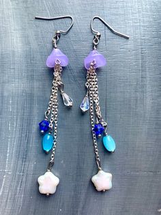 Cute handmade jellyfish dangle earrings made with glass and Pearl beads. Handmade Jellyfish, Etsy Earrings Dangle, Jellyfish, Pearl Beads, Favorite Jewelry, Jewelry Earrings Dangle, Dangle Drop Earrings, Dangle Earrings, Handmade Items