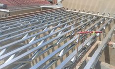 a metal roof is being installed on top of a building's roofing system