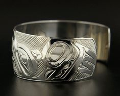 "This extraordinary hand-engraved cuff depicts the 'Raven Stealing the Light' myth: \"At the beginning of time, the whole world was dark. The reason for this blackness had to do with an old man in a house by one of the largest rivers on Earth, who had a box, which contained a box, which contained a box, which contained an infinite number of boxes, each nestled in a box slightly larger than itself until finally there was a box so small all it could contain was all the light in the universe. The o Engraved Cuff, Twist Ring, Silver Work, Old Man, Hand Engraving, Cuff Bracelet, Cuff Bracelets, Rings For Men, Old Things