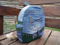 Recycled Denim Blue Backpack, Backpack for School. Stylish backpack manufactured from jeans and leather. A basic fabric backpack with three external pockets. There are two side pockets . The inside of the bag has a polyester lining and internal pockets, perfect for keeping valuables. The backpack is made of denim and padded with material to keep its shape even when it is empty. Very soft and lightweight but durable. This backpack has enough space inside to carry all your necessaries. That's why it's so good for light walking or everyday use. It can be used in travel. CARE: hand wash or wash machine delicate cycle 30 degrees.  Note that the different colors of the computer screen may vary slightly. The backpack approximate measurements are: 29cm x 22cm x 8,5cm;11,4in x 8,7in x 3,3in Fabric Backpack, Jeans Backpack, Urban Backpack, Backpack For School, Jean Backpack, Stylish Backpack, Fabric Wallet, Upcycle Jeans, College Bags