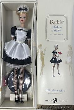 the barbie doll is in its original box