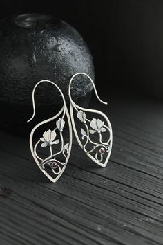 ITEM DESCRIPTION: Size H 6 x W 3 cm (2 1/2 x 1 inches) with closure. Wire earrings are very lightweight and comfortable for your ears. Weight - 3 g of each other. The blooming magnolia is so delicate and calm! I was fascinated by this spring flower and was inspired to make these earrings to recreate the beauty of nature. I made wire earrings of sterling silver and natural pink opal. This stone has a light pink color - the same as magnolia petals. Floral earrings will come to you in a gift box - Nature-inspired Drop Flower Earrings For Pierced Ears, Artistic Flower Shaped Ear Wire Jewelry, Handmade Silver Botanical Earrings, Nature-inspired Flower Shaped Ear Wire Jewelry, Nature-inspired Flower Shape Jewelry With Ear Wire, Artistic Flower-shaped Earrings With Ear Wire, Nature-inspired Flower Jewelry With Ear Wire, Unique Flower-shaped Pierced Earrings, Nature-inspired Silver Flower Drop Earrings