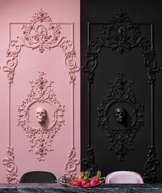 two black and pink walls with skulls in the middle one has a skull head on it