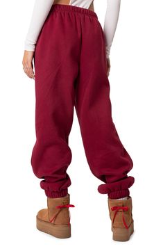 Love to lounge in these slouchy sweatpants crafted from a soft cotton blend with handy side pockets. Elastic waist Side pockets 50% cotton, 50% polyester Machine wash, dry flat Imported Oversized Comfy Cotton Sweatpants, Cozy Solid Color Sweatpants For Streetwear, Oversized Cotton Sporty Joggers, Oversized Cotton Joggers With Ribbed Cuffs, Winter Baggy Sweats With Ribbed Cuffs, Comfy Streetwear Pants With Ribbed Cuffs, Baggy Sweats For Leisure In Fall, Oversized Sweatpants For Leisure, Casual Oversized Bottoms With Elastic Cuffs