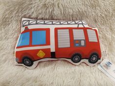 a pillow shaped like a fire truck