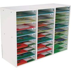 a white shelf with many different colored folders on it's sides and labels in each drawer