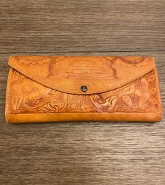 "Vintage Mexico Tooled Leather Wallet Leather Exterior Vinyl Interior  Lots of Pockets and Compartments to put everything you need Stitching loose on one place See photos for Condition and Description  Measures Approx 9\" x 4.25\" Pre-Owned Vintage Condition" Traditional Bifold Wallets For Everyday Use, Traditional Bifold Wallet For Everyday Use, Traditional Hand Tooled Wallets For Everyday Use, Traditional Wallets With Card Slots For Everyday Use, Traditional Wallets With Card Slots, Hand Tooled Bifold Clutch For Everyday Use, Vinyl Interior, Tooled Leather Wallet, Vintage Mexico