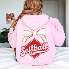 Hit a Home Run with Our "Softball" Coquette Bow Hoodie Sweatshirt!  Searching for the perfect Softball Sweatshirt or Softball Hoodie? Look no further! Our "Softball" Coquette Bow Hoodie Sweatshirt is a game-changer for any softball fan. Whether you're looking for Cute Softball Hoodies for Girls, Softball Mom Sweatshirts, or a unique gift for your softball team, this hoodie is designed to impress and keep you cozy all season long. Why You'll Love Our "Softball" Coquette Bow Hoodie Sweatshirt: Unm College Sports Fan Long Sleeve Hoodie, Varsity Long Sleeve Hoodie For Game Day, Sports Fan Long Sleeve Hoodie For Winter, Winter Long Sleeve Sports Fan Hoodie, Sports Fan Long Sleeve Hoodie For Fall, Fall Sports Fan Hooded Hoodie, Sports Fan Hooded Hoodie For Fall, Sports Fan Hoodie For Fall, Winter Sports Fan Hoodie Sweatshirt