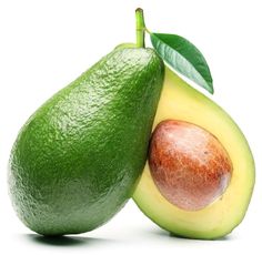 an avocado and tomato on a white background with one half cut in half