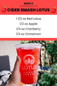 a hand holding up a red drink with information about the ingredients and how to use it