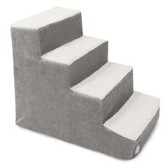 a set of stairs made out of grey fabric with white carpet on the bottom and bottom