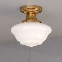 a white light hanging from the ceiling in a room