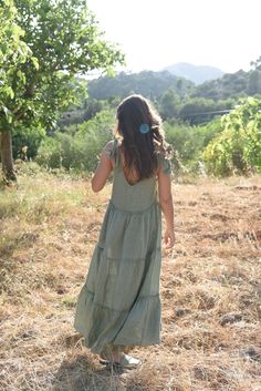 Style // V-neckline & low back, in a subtle, soothing and summer infusing sage linen! A true goes-with-anything essential, guaranteed to turn heads in this timeless linen maxi dress with tie closures at the shoulders for added dimension and versatility. With that perfect drapey and relaxed fit, the stunning Sevilla Dress was designed to be dressed up with a strappy sandal or barefoot for that effortlessly beautiful look! Fit Note: Available in one size fits most. Bust: 38" Length: 53" (with stra Linen Sundress Maxi Dress With Tie Back, Spring Linen Maxi Dress With Tie Back, Sage Dresses For Summer Beach, Linen Maxi Dress With Tie Straps For Vacation, Chic Linen Maxi Dress With Tie Straps, Summer Sage V-neck Dress, Summer Linen Maxi Dress With Tie Straps, Chic Sage Summer Dress, Linen Maxi Dress With Tie Straps