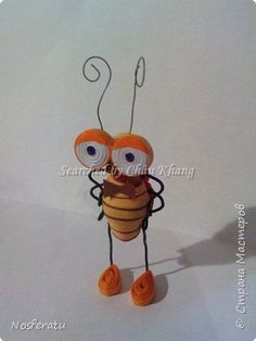 a paper doll made to look like a bee