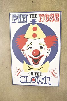 a sign that says pin the nose on the clown