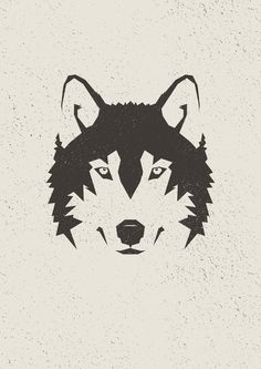 a black and white wolf's head on a gray background