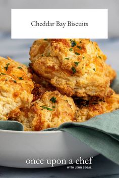 three cheddar bay biscuits in a white bowl