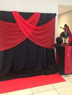 a red and black stage set up for a party