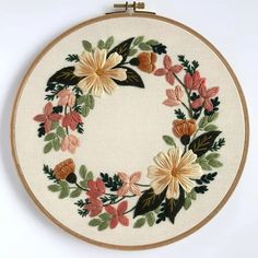 an embroidered hoop with flowers on it