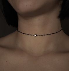 Queen of December. Inspired by the magic of winter skies. Composed of tiny gold electroplated hematite star, black rhodium over 925 sterling silver delicate chain and components. Such a delicate and sparkling piece with a unique dark vibe . The tiny stars sparkle in silver and blue tones. You can choose between 3 chain lengths: 12 / 13 / 14 inches Not sure which length to buy? We can add a 1 inch extender chain. Just write a note at checkout! ❈ We send all our items with registered mail. ❉ Due to the organic nature of stones, there might be a slight variation in colour, size and shape. ✺ All items come packaged in a quality velvet pouch ready for gift giving. ✽ If you want to make a special order, just contact us! Black Adjustable Necklace With Star Charm, Adjustable Black Necklace With Star Charm, Dark Winter Jewelry, Black Star Charm Choker Jewelry, Black Star Charm Choker Necklace, Black Star-shaped Sterling Silver Necklace, Edgy Star-shaped Jewelry With Star Charm, Adjustable Minimalist Star Jewelry, Elegant Black Jewelry With Star Charm