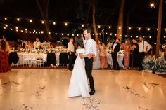 a bride and groom sharing their first dance