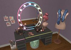 a desk with a mirror, lamp and other items on it in a room that has purple walls