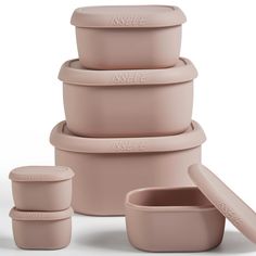 the stack of pink pots and pans is shown