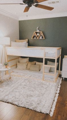 a bedroom with a loft bed and white rugs on the floor, along with a couch