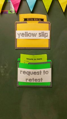 two bulletin boards with yellow slip and request to retest written on them, in front of colorful bunting