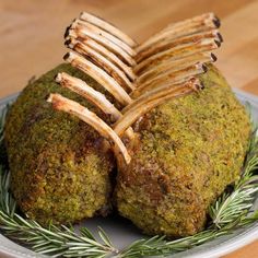 some kind of food on a plate that is sitting on a table with wood sticks sticking out of it