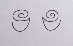 two small spirals are drawn on a piece of paper