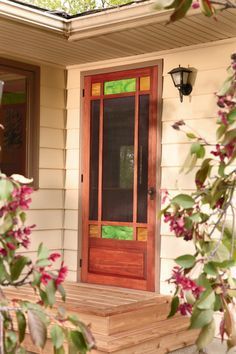 a red front door sitting on the side of a house