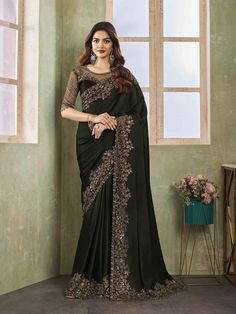 Shyla Satin Silk Embroidered Tiki Work Designer Border Saree Premium quality fabric Enhanced with thread & tiki embroidery work. Comes with unstitch blouse fabric High quality fabric and stitching. Introducing the Shyla Saree, made from luxurious satin silk and adorned with intricate embroidered tiki work and designer borders. Luxury Traditional Saree With Intricate Embroidery, Luxury Black Saree With Zari Work, Luxury Saree With Border, Luxury Black Saree With Intricate Embroidery, Luxury Traditional Wear With Embroidered Border, Luxury Traditional Saree With Embroidered Border, Luxury Black Dress With Embroidered Border, Luxury Designer Saree With Border, Luxury Silk Thread Saree With Embroidered Border