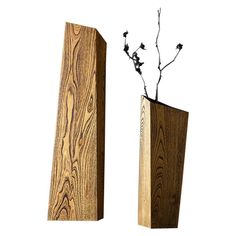 two wooden vases with flowers in them on a white background, one is tall and the other is short