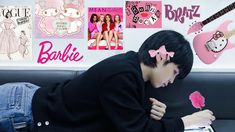 a person sitting on a couch with pink decorations and guitar stickers all over the wall