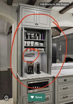 a kitchen with grey cabinets and white counter tops, has the circled photo in red